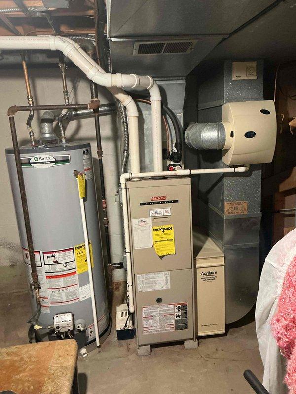 Responded to recall for air conditioning unit experiencing icing issues and failure to operate. Upon inspection, found Lennox system with refrigerant circuit problems causing complete loss of cooling to the home. Checked refrigerant pressures and system operation, identified abnormal operating conditions leading to evaporator coil freeze-up. Documented equipment condition including indoor air handler, furnace assembly, and associated components. System requires further diagnostic work to determine root cause of refrigerant-related failure and restore proper cooling function.