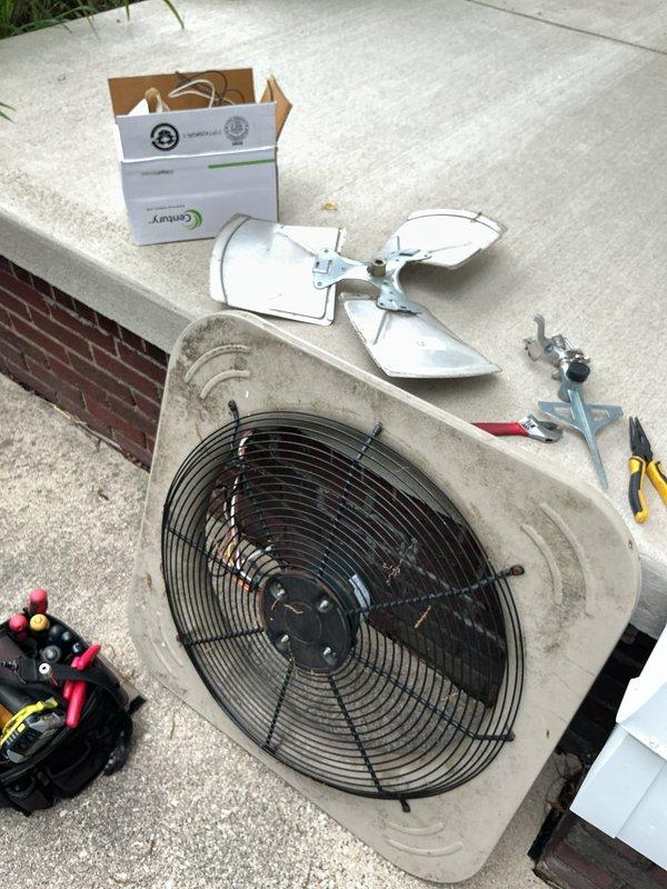 Responded to service call for non-operational condenser fan that had been recently replaced. Upon inspection, confirmed the new Genteq condenser fan motor was not spinning despite previous installation. Diagnosed the issue, removed the defective motor assembly, and installed a replacement condenser fan motor and blade assembly. Tested system operation to verify proper fan rotation and airflow through the condensing unit. Advised customer that warranty coverage was uncertain and potential service charges may apply for the callback repair.