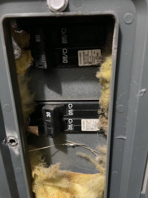 Conducted commercial AC replacement estimate for office space. Evaluated existing American Standard HVAC unit in basement utility area and assessed electrical panel with 60-amp breakers and foam weatherproofing. Documented equipment specifications, electrical infrastructure, and ductwork configuration to prepare comprehensive replacement proposal.