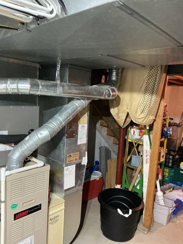 Responded to no cooling complaint with outdoor unit fan blades not spinning. Upon arrival, inspected Lennox HVAC system and associated equipment in basement mechanical room. Verified system components and documented existing installation including furnace, ductwork, and Aprilaire humidifier for service records.