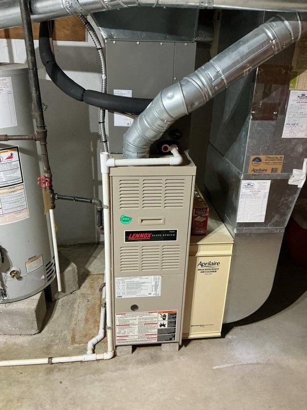 Responded to no cooling complaint with outdoor unit fan blades not spinning. Upon arrival, inspected Lennox HVAC system and associated equipment in basement mechanical room. Verified system components and documented existing installation including furnace, ductwork, and Aprilaire humidifier for service records.