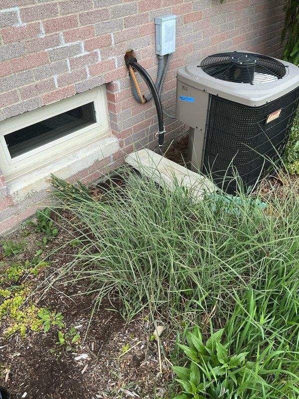 Responded to no cooling complaint on 20-year-old residential air conditioning system. Upon arrival, confirmed unit was running continuously with minimal cooling output affecting entire home. Performed comprehensive system evaluation including refrigerant charge verification, airflow measurements, and electrical diagnostics. Found system operating with significantly reduced capacity due to age-related component degradation. Compressor amperage readings indicated decreased efficiency, and condenser coil showed signs of internal restrictions despite external cleaning. Indoor evaporator coil airflow was adequate through Unicell furnace system. Given the unit's age at 20 years—well beyond typical 15-year service life—and the extent of wear on major components, recommended system replacement rather than repair. Discussed options with homeowner regarding new high-efficiency equipment that would provide reliable cooling and reduced operating costs. Unit currently operational but unable to meet
