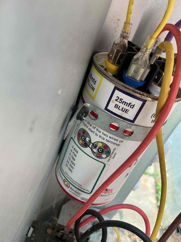 Responded to no-cooling call on 10-year-old residential air conditioning system. Customer reported indoor air handler operating normally but outdoor condenser unit failing to start, affecting whole house comfort. Upon arrival, performed diagnostic testing on outdoor unit and identified failed run capacitor preventing compressor and condenser fan motor operation. Verified proper voltage supply to unit and confirmed contactor engaging properly. Replaced defective dual-run capacitor with new 25 MFD capacitor, ensuring proper wire connections per manufacturer specifications. Tested system operation and confirmed condenser unit starting properly with compressor and fan motor running within normal parameters. Verified adequate airflow from indoor unit and monitored system for proper cooling cycle. System restored to full operational status.