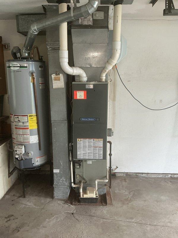 Responded to no cooling call on 15+ year old air conditioning system. Upon arrival, found unit completely inoperative with no power to outdoor condensing unit. Diagnosed failed contactor preventing compressor and condenser fan operation. Replaced contactor, restored power to system, and verified proper startup sequence. System now cooling effectively with normal operating pressures and amperage readings.