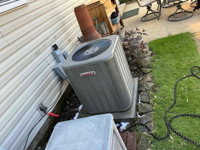 Completed scheduled cooling maintenance visit on 4-year-old Lennox air conditioning system per maintenance agreement. Performed comprehensive inspection of outdoor condenser unit, including visual examination of cabinet condition, fan operation, and refrigerant line connections. Verified electrical disconnect box functionality and checked service valve accessibility. Unit found operating within normal parameters with no immediate concerns identified. Documented equipment condition through photographic records for service history. System ready for continued seasonal operation.