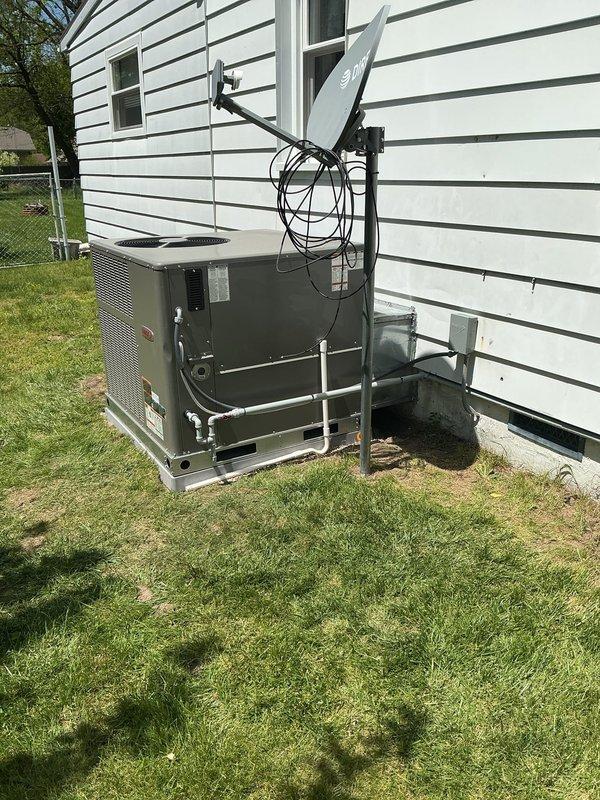 Completed installation of new gas pack HVAC unit at residential property. Unit was positioned on concrete pad along exterior wall, leveled to manufacturer specifications, and all electrical connections and gas lines were properly secured. System was tested and verified to be operating within normal parameters upon completion.