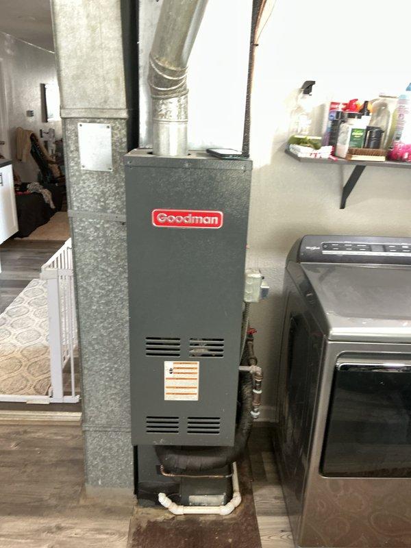 Responded to service call for central air conditioning system producing loud squealing and squeaking noises from outdoor unit. Upon arrival, inspected 9-year-old AC system and indoor Goodman furnace unit that had been previously serviced by other technicians. Investigated noise complaint and verified operational status of condensing unit, refrigerant lines, and indoor air handler components. Assessed previous refrigerant service work and examined compressor, condenser fan motor, and belt-driven components for mechanical wear or bearing failure causing abnormal sounds.