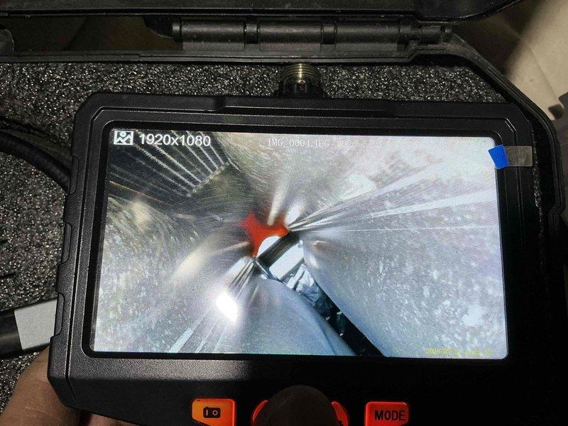 Performed comprehensive air conditioning tune-up on residential HVAC system estimated to be over 10 years old. Conducted thorough inspection of ductwork using digital borescope camera to assess interior condition, checking for debris, damage, and proper airflow pathways throughout the ventilation system.