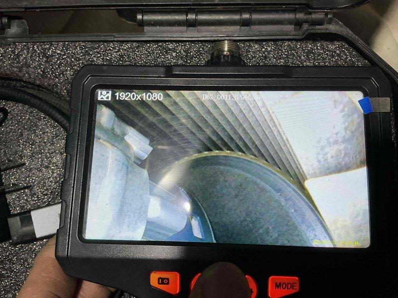 Performed comprehensive air conditioning tune-up on residential HVAC system estimated to be over 10 years old. Conducted thorough inspection of ductwork using digital borescope camera to assess interior condition, checking for debris, damage, and proper airflow pathways throughout the ventilation system.