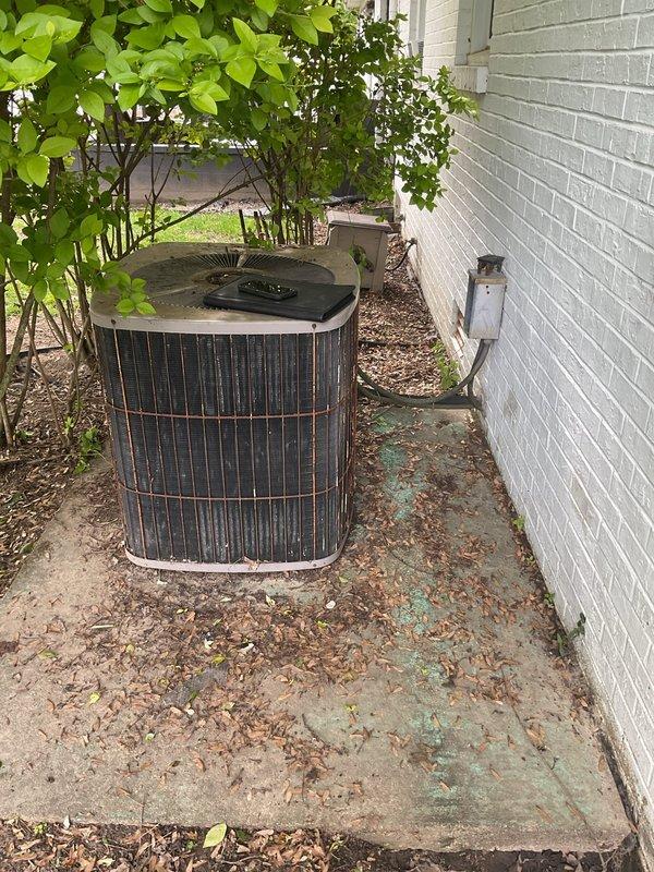 Conducted comprehensive AC replacement estimate for residential property. Evaluated existing outdoor Lennox condenser unit showing significant weathering, discoloration, and age-related deterioration on concrete pad with algae growth, along with indoor Lennox furnace system with proper PVC venting configuration. Documented current equipment conditions, measurements, and installation specifications to provide replacement system recommendations and pricing options for complete HVAC system upgrade.