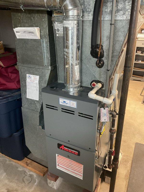 Completed comprehensive estimate for residential air conditioning system replacement and filter box replacement. Assessed existing HVAC equipment in basement mechanical room, including current furnace unit, ductwork configuration, and air handler system. Documented existing equipment specifications, spatial constraints, and necessary modifications required for new AC installation. Photographed current system setup showing galvanized metal ductwork, copper refrigerant lines, PVC condensate drainage, and electrical connections to provide accurate replacement specifications and ensure proper sizing for new equipment.