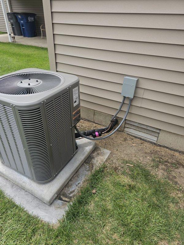 Completed installation of a 13 SEER, 2-ton package air conditioning unit at residential property. Installed new concrete equipment pad to provide stable, level foundation for unit placement. Ran new 3/4-inch copper lineset approximately 25 feet from unit to building connection point. Mounted new electrical disconnect box on exterior wall with appropriate whip assembly for unit power connection. Installed programmable thermostat inside residence to provide enhanced temperature control and energy management capabilities. All electrical connections completed to code specifications, unit tested and verified operational upon completion.