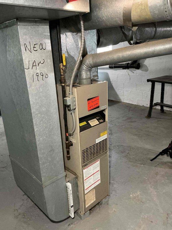 # Emergency No-Heat Service Call

Responded to emergency service call for furnace not operating following recent house work. Upon arrival, found vintage 1990 heating system with furnace completely non-responsive. Performed comprehensive diagnostic evaluation of aged equipment.

## Diagnostic Findings

Conducted visual inspection and system assessment of residential gas furnace. Unit showed no signs of power or attempted ignition sequence. Inspected electrical connections, gas valve assembly, and control board for obvious failures or damage. Examined thermostat wiring and verified proper connections at unit. Checked for tripped breakers or blown fuses that may have resulted from recent house work activities.

## Work Performed

Removed front access panel to access internal components and control systems. Traced electrical circuits from power source through safety switches, limit controls, and ignition system. Tested voltage at multiple points throughout control circuit to isolate failur