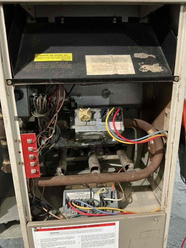 # Emergency No-Heat Service Call

Responded to emergency service call for furnace not operating following recent house work. Upon arrival, found vintage 1990 heating system with furnace completely non-responsive. Performed comprehensive diagnostic evaluation of aged equipment.

## Diagnostic Findings

Conducted visual inspection and system assessment of residential gas furnace. Unit showed no signs of power or attempted ignition sequence. Inspected electrical connections, gas valve assembly, and control board for obvious failures or damage. Examined thermostat wiring and verified proper connections at unit. Checked for tripped breakers or blown fuses that may have resulted from recent house work activities.

## Work Performed

Removed front access panel to access internal components and control systems. Traced electrical circuits from power source through safety switches, limit controls, and ignition system. Tested voltage at multiple points throughout control circuit to isolate failur