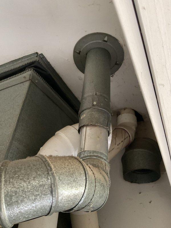 Completed comprehensive plumbing estimate for tankless water heater installation in residential property. Assessed existing water heater infrastructure, including current venting system with metal ductwork and PVC piping configuration, and evaluated electrical panel capacity to ensure adequate power supply for new tankless unit. Documented existing conditions through photographic evidence, noting current pipe routing, ventilation components, and available electrical service to determine installation requirements and feasibility for tankless water heater conversion.