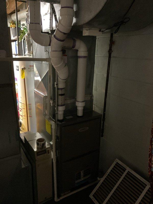 Conducted comprehensive AC replacement estimate for residential property. Evaluated existing Goodman outdoor condensing unit positioned on concrete pad against exterior brick wall, along with indoor furnace system located in basement mechanical room with associated PVC venting infrastructure. Assessed current equipment condition, measured installation space requirements, documented electrical disconnect configuration, and reviewed existing ductwork and drainage systems to provide complete system replacement specifications.