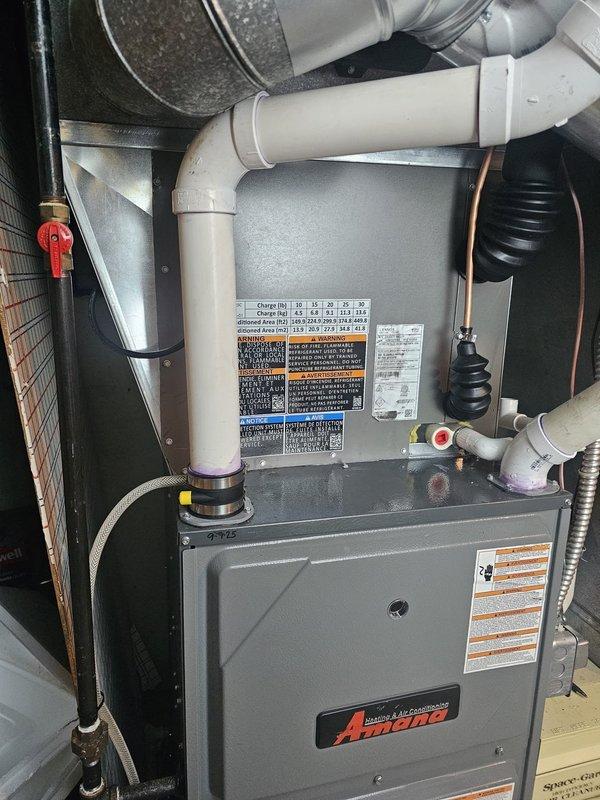 Completed installation of a 4-ton, 14 SEER single-stage air conditioning system with matching evaporator coil. Uncased the coil due to height restrictions in the mechanical room to ensure proper fit with existing furnace configuration. Installed new 7/8" x 25' refrigerant line set with proper insulation, routing copper lines through utility space and connecting to outdoor condenser unit. Set new outdoor equipment pad and mounted condenser, then installed new electrical disconnect and whip for code-compliant power supply to outdoor unit. Verified all refrigerant connections were properly brazed and leak-free. Reused existing thermostat, confirming compatibility with new system. All ductwork connections secured to evaporator coil with proper sealing. System tested for proper operation, airflow, and temperature differential across coil.