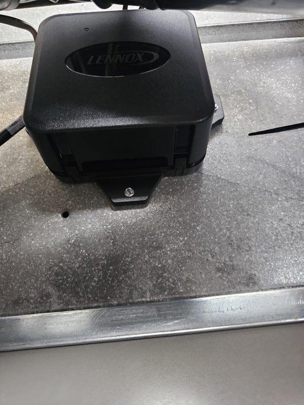 Completed installation of a 4-ton, 14 SEER single-stage air conditioning system with matching evaporator coil. Uncased the coil due to height restrictions in the mechanical room to ensure proper fit with existing furnace configuration. Installed new 7/8" x 25' refrigerant line set with proper insulation, routing copper lines through utility space and connecting to outdoor condenser unit. Set new outdoor equipment pad and mounted condenser, then installed new electrical disconnect and whip for code-compliant power supply to outdoor unit. Verified all refrigerant connections were properly brazed and leak-free. Reused existing thermostat, confirming compatibility with new system. All ductwork connections secured to evaporator coil with proper sealing. System tested for proper operation, airflow, and temperature differential across coil.