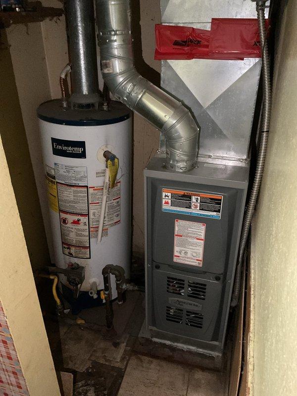 Conducted on-site evaluation for water heater replacement in residential mechanical room. Assessed existing Envirotemp water heater unit with connected gas lines, shut-off valves, and water supply piping. Documented current installation configuration including proximity to furnace unit and existing electrical connections. Evaluated potential electrical upgrades required for new water heater installation, examining current wiring capacity and code compliance requirements. Photographed mechanical room layout, ductwork clearances, and utility connections to develop comprehensive replacement proposal.