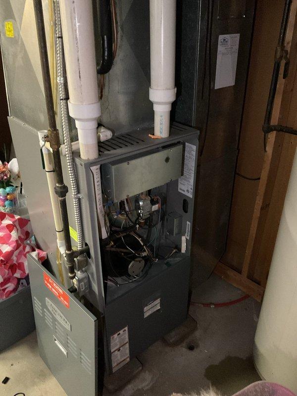 Completed comprehensive estimate for full HVAC system replacement including outdoor air conditioning condenser unit and indoor gas furnace. Assessed existing equipment condition, documented current installation with exterior-mounted AC unit on concrete pad with associated electrical components and meter, and basement-installed furnace with PVC venting system. Provided detailed replacement recommendations and specifications for new high-efficiency heating and cooling equipment to meet customer's comfort and energy efficiency requirements.