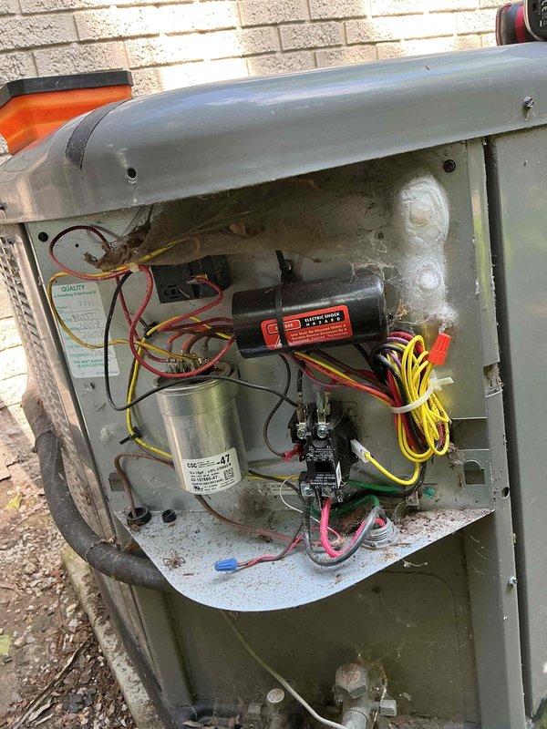 Completed seasonal cooling maintenance on outdoor condensing unit aged 10-15 years. Performed comprehensive system inspection including electrical components, capacitor, contactor, and compressor connections. All components found operating within normal parameters with typical accumulation of outdoor debris and surface contamination noted on refrigerant lines and exterior casing.
