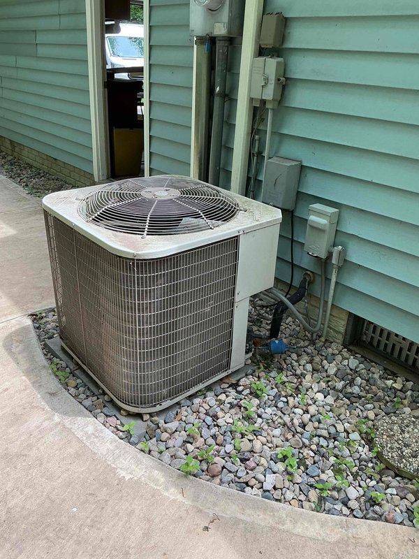 Completed preventive maintenance tune-up on 8-year-old residential air conditioning system. Inspected outdoor condensing unit, electrical components, and capacitor; verified proper operation of contactor and all electrical connections. System tested and running efficiently with no issues found.