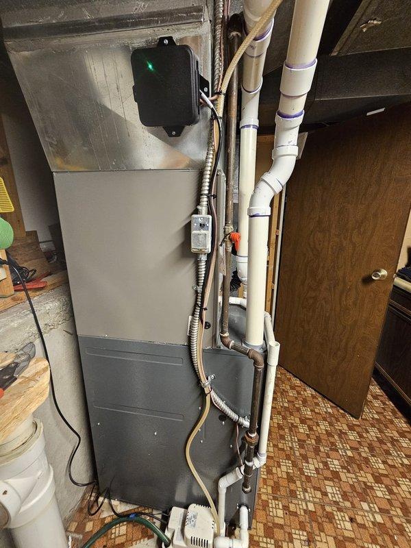 Completed installation of 2.5 ton single-stage AC package unit with slim duct air handler. Relocated condenser unit from concrete to new pad in flower bed, maintaining required 3-foot clearance from electrical meter per code. Installed new 3/4-inch line set spanning 205 feet connecting outdoor condenser to indoor air handler. Ran new electrical whip and installed disconnect box at exterior unit location. Mounted programmable thermostat for system control. All refrigerant lines properly insulated and secured, condensate drainage installed with appropriate traps, and electrical connections completed to code specifications. System tested and operational upon completion.
