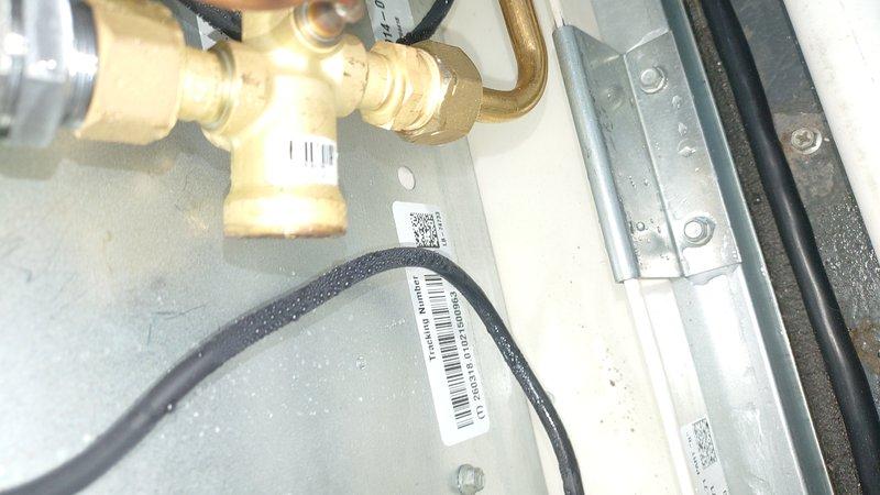 Responded to service call for water leak following recent A/C installation. Upon arrival, inspected system components including condensate drain lines, evaporator coil connections, and refrigerant line insulation. Verified unit levelness using precision level tool and checked all plumbing connections at indoor air handler for proper installation and potential leak sources. Documented equipment installation with focus on copper line connections, mounting hardware, and condensate management system to identify source of reported water intrusion.