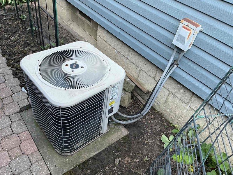 Performed scheduled air conditioning maintenance on 23-year-old residential cooling system. Completed comprehensive inspection of outdoor condenser unit, electrical components, and refrigerant connections. Verified proper operation of compressor, capacitor, and contactor assembly within electrical compartment, ensuring all wire connections were secure and system was functioning within manufacturer specifications.