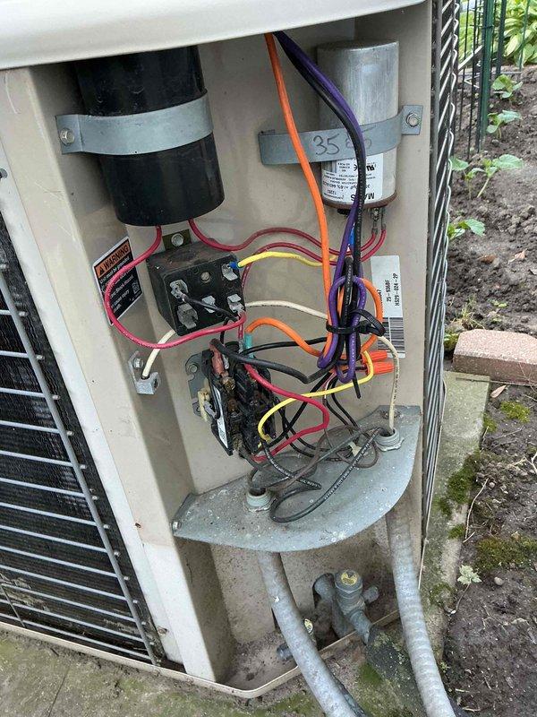 Performed scheduled air conditioning maintenance on 23-year-old residential cooling system. Completed comprehensive inspection of outdoor condenser unit, electrical components, and refrigerant connections. Verified proper operation of compressor, capacitor, and contactor assembly within electrical compartment, ensuring all wire connections were secure and system was functioning within manufacturer specifications.