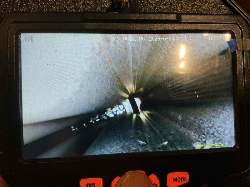 Completed comprehensive maintenance tune-up on 30-year-old outdoor air conditioning unit. Performed detailed inspection of evaporator coil and internal ductwork components using borescope camera, revealing accumulated dirt and debris on coil fins. Unit operational following standard preventive maintenance procedures.