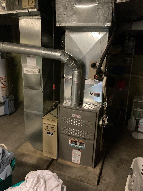 Completed comprehensive estimate for full HVAC system replacement at residential property. Assessed existing outdoor Lennox condenser unit installed against brick exterior and indoor Lennox furnace located in basement mechanical room. Documented current equipment specifications, measured installation clearances, evaluated electrical disconnect and line set routing, and photographed existing system configuration. Provided customer with detailed replacement options for new high-efficiency air conditioning condenser and compatible furnace system to improve cooling performance and energy efficiency.