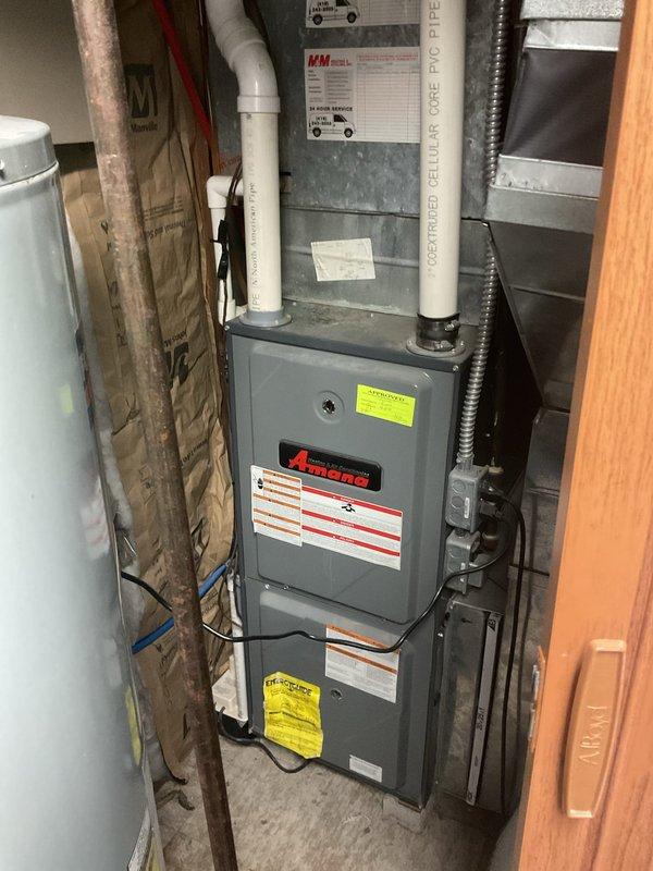 Completed comprehensive HVAC system evaluation for full equipment replacement at residential property. Assessment included existing outdoor mini-split heat pump condenser unit and indoor Amana air handler with associated ductwork, refrigerant lines, condensate drainage systems, and electrical connections. Documented current equipment condition, placement configurations, and mechanical room infrastructure to provide accurate replacement specifications and installation requirements.