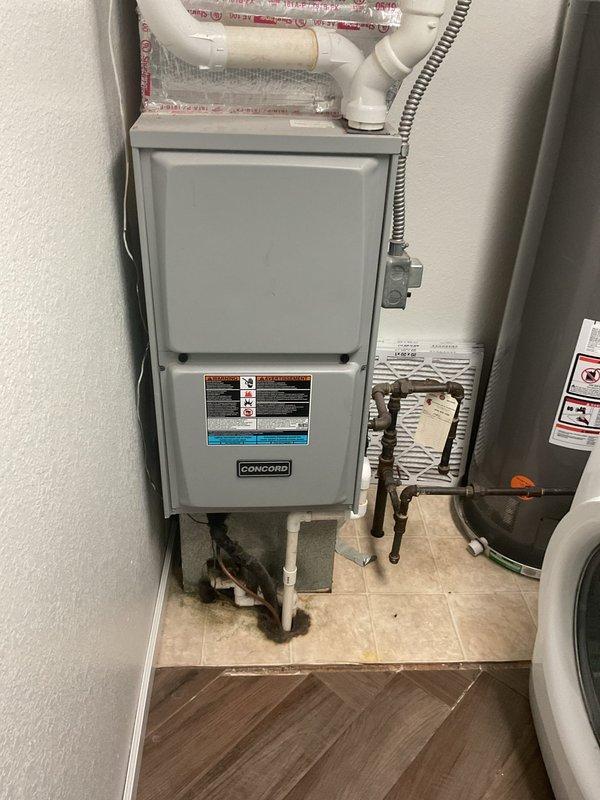 Conducted comprehensive evaluation of existing HVAC system for air conditioning replacement estimate. Assessed current Concord furnace installation and associated mechanical components including air handler unit, copper refrigerant lines, PVC condensate drainage system, and flexible electrical conduit. Documented equipment configuration in interior mechanical closet, noting standard residential installation with existing infrastructure suitable for new AC system integration. Photographed current setup to provide accurate replacement specifications and facilitate proper equipment sizing for upcoming air conditioning unit installation.