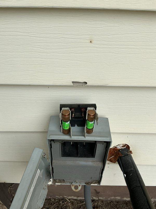 Completed scheduled air conditioning maintenance on 13-year-old system. Performed standard cooling season inspection including capacitor testing with multimeter to verify proper electrical function and checked disconnect box fuses for integrity. All components tested within normal operating parameters and system found to be functioning properly for continued cooling operation.