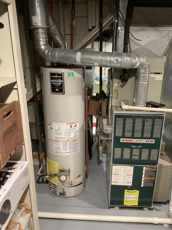 Conducted comprehensive assessment of existing HVAC system for full replacement estimate. Evaluated current Trane XV80 furnace unit and associated air handler equipment located in basement mechanical room. Documented existing ductwork configuration, including metallic supply ducts and flexible aluminum connections routing from equipment. Assessed condition of current system components, support structures, and utility connections including gas lines, electrical service, and condensate drainage. Photographed equipment specifications, model numbers, and existing installation layout to determine proper replacement sizing and configuration requirements. Provided detailed estimate for complete system replacement including new furnace, air handler, ductwork modifications as needed, and all associated installation labor and materials.