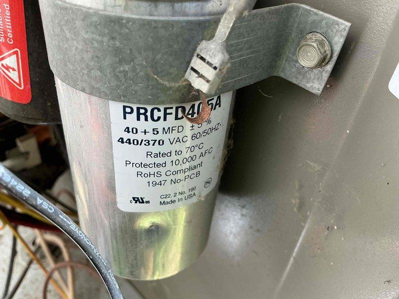 Completed MVP cooling maintenance visit on 18-year-old air conditioning system. Performed comprehensive inspection of Lennox HVAC unit, including evaluation of dual-run capacitor (PRCFD4075A, 40+5 MFD, 440/370 VAC) which showed proper specifications and secure mounting. Verified all electrical connections, refrigerant lines, condensate drainage system, and ductwork connections were intact and functioning properly with no visible defects or deterioration noted.