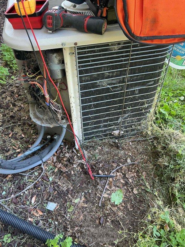 Completed comprehensive AC tune-up on 27-year-old outdoor condensing unit. System showed significant accumulation of environmental debris, dirt, and cobwebs on condenser coils and grille surfaces, consistent with age and exposure. Performed standard maintenance procedures including cleaning of condenser coils, inspection of refrigerant lines, and evaluation of overall unit operation to ensure continued functionality of aging system.
