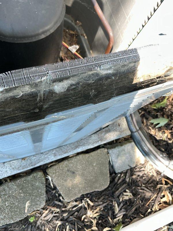 # HVAC Maintenance - Cooling

Completed routine maintenance on a 5-year-old Amana air conditioning system. Upon inspection, discovered the condenser coils were heavily clogged with dust, dirt, and lint accumulation, significantly restricting airflow through the unit. Thoroughly cleaned the aluminum cooling fins to remove debris buildup and restore proper heat exchange efficiency. Verified refrigerant lines, electrical connections, and condensate drain operation. Unit is now operating within normal parameters with improved airflow and cooling capacity.