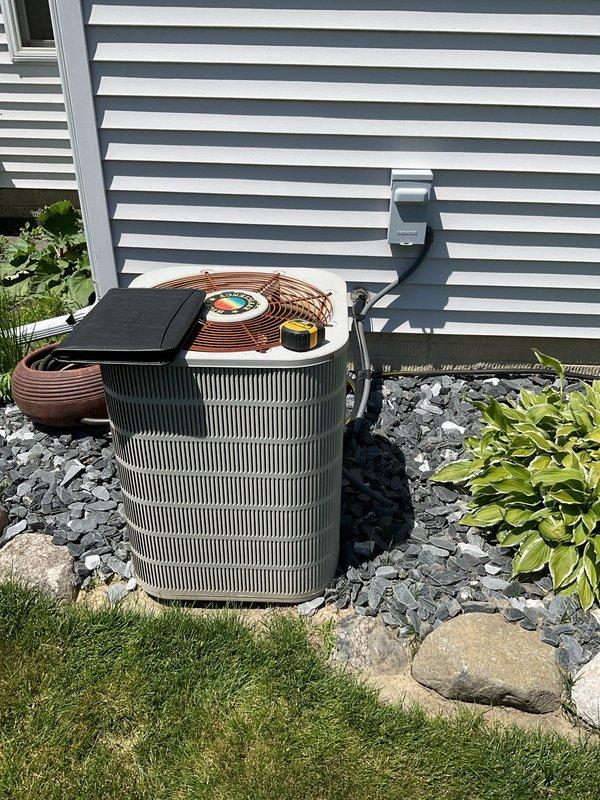 Completed comprehensive estimate for full HVAC system replacement including outdoor condensing unit and indoor furnace. Evaluated existing equipment consisting of cylindrical outdoor condenser with copper refrigerant lines, basement furnace with exposed blower assembly, and associated ductwork to provide detailed replacement specifications and recommendations for complete system upgrade.