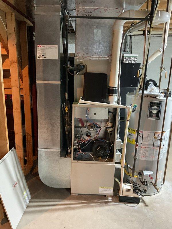 Completed comprehensive estimate for full HVAC system replacement including outdoor condensing unit and indoor furnace. Evaluated existing equipment consisting of cylindrical outdoor condenser with copper refrigerant lines, basement furnace with exposed blower assembly, and associated ductwork to provide detailed replacement specifications and recommendations for complete system upgrade.