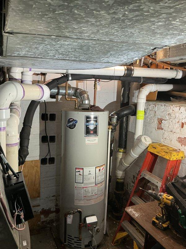 Completed installation of new air conditioning system with upflow cased coil package in basement location. Installed new line set, outdoor condensing unit on relocated metal pad positioned away from existing mini-split system, new electrical disconnect, and programmable thermostat. System tested and operational upon completion with all components properly secured and connected per manufacturer specifications.