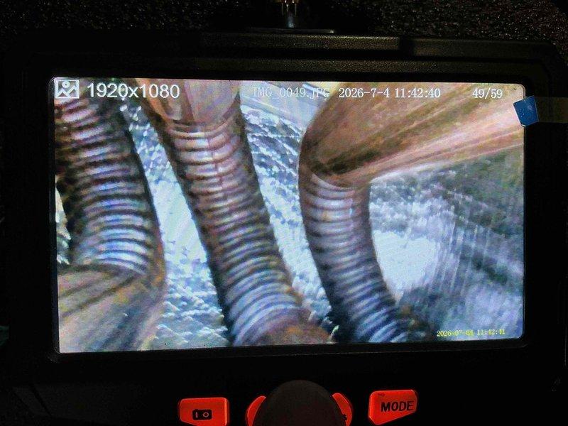 Completed standard HVAC tune-up maintenance on a 2-year-old air conditioning system. Performed inspection using digital camera equipment to document internal components, including refrigerant line connections and evaporator coil assembly. Customer inquired about membership program renewal during service visit.
