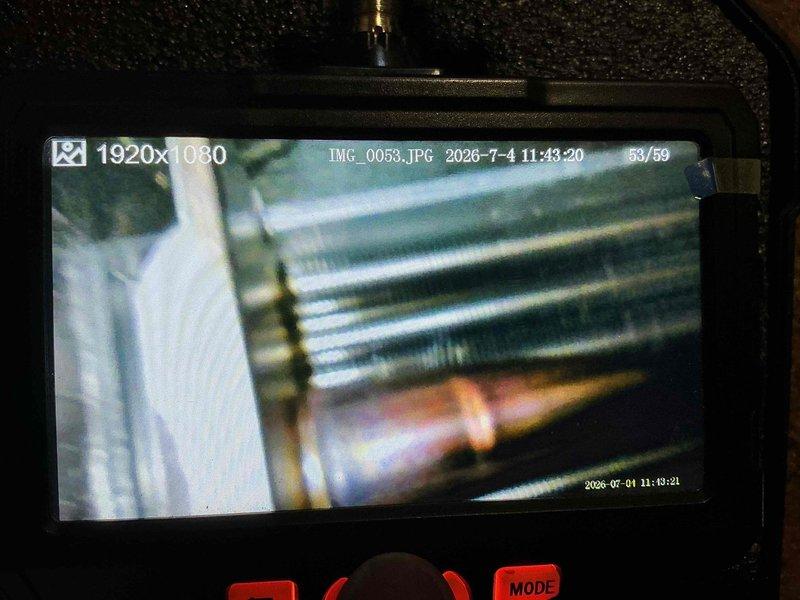 Completed standard HVAC tune-up maintenance on a 2-year-old air conditioning system. Performed inspection using digital camera equipment to document internal components, including refrigerant line connections and evaporator coil assembly. Customer inquired about membership program renewal during service visit.