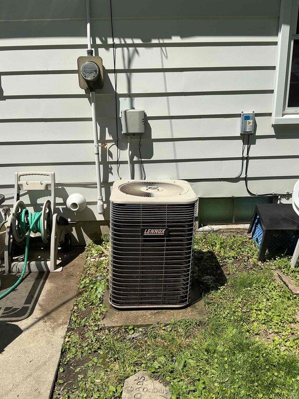 Completed comprehensive air conditioning tune-up service on residential Lennox HVAC system following rescheduled appointment due to temperature conditions. Performed standard preventive maintenance procedures on outdoor condensing unit and indoor furnace/air handler, inspected electrical connections and disconnect components, and verified proper system operation with photographic documentation of equipment condition.