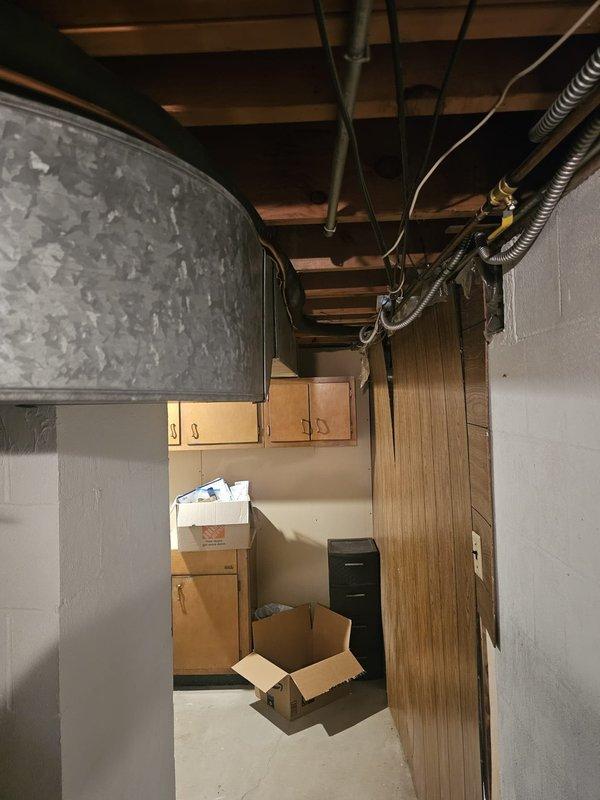 Completed installation of new air conditioning system with upflow cased coil package in basement location. Installed 3/4" x 30' refrigerant line set with proper insulation, routed through floor joists and secured with appropriate mounting hardware. Set new outdoor condensing unit on concrete pad with required disconnect and whip for electrical connection. Mounted upflow coil in existing ductwork with new 16x25x5 metal filter rack for proper filtration. Installed programmable thermostat for enhanced temperature control and energy efficiency. Evacuated refrigerant lines to manufacturer specifications, charged system to proper levels, and verified all electrical connections meet code requirements. Tested system operation through complete cooling cycle, confirmed proper airflow, temperature split, and thermostat functionality. All components operating within normal parameters and system ready for service.