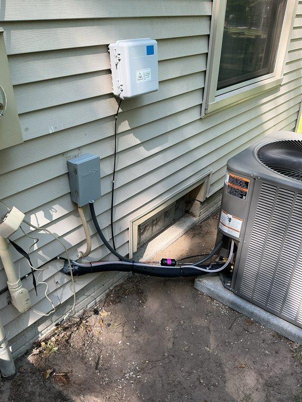Completed full HVAC system replacement installing a Lennox 13 SEER 3.5 ton split gas system with 96% efficiency 90KBTU upflow furnace in basement utility area. Installation included new upflow cased coil, 7/8" x 30' refrigerant line set, 13 SEER condensing unit mounted on new exterior pad with disconnect box, replacement venting system, 120V condensate pump, and WiFi-enabled thermostat for remote system control. All electrical connections, conduit routing, and PVC drainage lines were properly installed per manufacturer specifications, with the outdoor unit positioned on concrete pad adjacent to home exterior with complete refrigerant line and electrical service connections.
