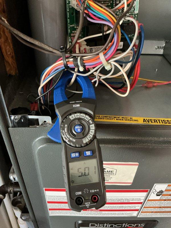 Completed scheduled maintenance on 12-year-old air conditioning system. Performed electrical diagnostics using digital multimeter to verify proper voltage and amperage readings at control board and contactor. Inspected wiring connections at both indoor unit control system and outdoor condensing unit, confirming all terminals secure and connections intact. Evaluated contactor operation and electrical components for proper function. System tested and operating within normal parameters upon completion of maintenance service.