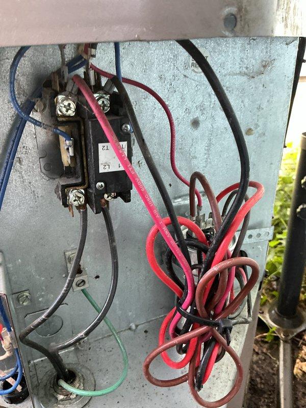 Completed scheduled maintenance on 12-year-old air conditioning system. Performed electrical diagnostics using digital multimeter to verify proper voltage and amperage readings at control board and contactor. Inspected wiring connections at both indoor unit control system and outdoor condensing unit, confirming all terminals secure and connections intact. Evaluated contactor operation and electrical components for proper function. System tested and operating within normal parameters upon completion of maintenance service.