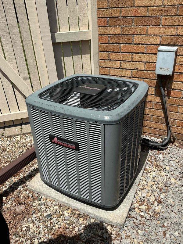 # HVAC Maintenance - Cooling

Completed comprehensive annual maintenance service on a 5-year-old Amana air conditioning system that had not been serviced in 2 years. Performed complete AC tune-up including inspection of outdoor condensing unit and indoor air handler components.

## Outdoor Unit Service

Inspected Amana condensing unit positioned on concrete pad with proper clearances maintained. Verified electrical disconnect box and conduit connections secure with no visible damage. Removed debris and leaves from gravel base surrounding unit. Cleaned condenser coil fins and removed accumulated dirt and obstructions from exterior louvers. Checked fan motor operation and lubricated as needed. Measured and recorded voltage and amperage readings at compressor and fan motor. Verified proper refrigerant pressures and system charge. Inspected mounting pad for levelness and stability.

## Indoor System Service

Inspected furnace-mounted air handler in basement mechanical room. Checked evapora